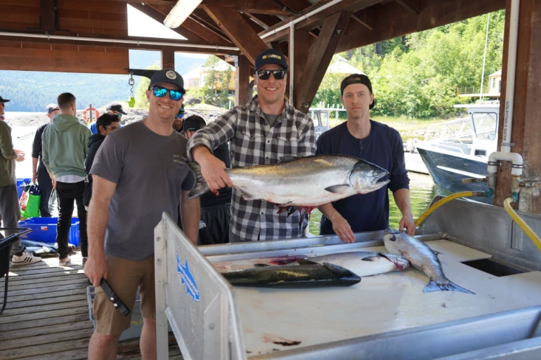 Friends showing Chinook Salmon caught